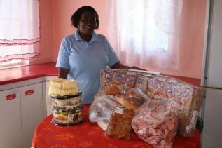 Vuyo as pleased as punch with the donations from Miracle Meals and Mount Pleasant SPAR